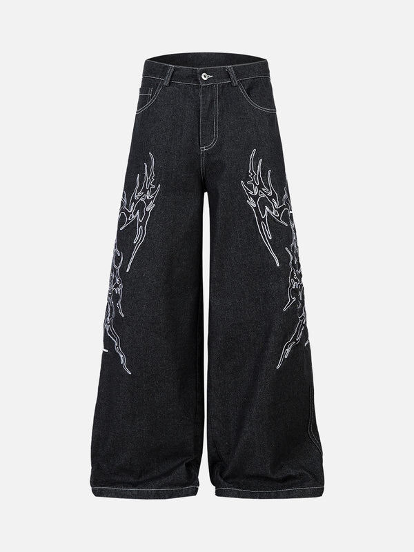 Baggy jeans with flame embroidery showcasing bold style by TALISHKO.