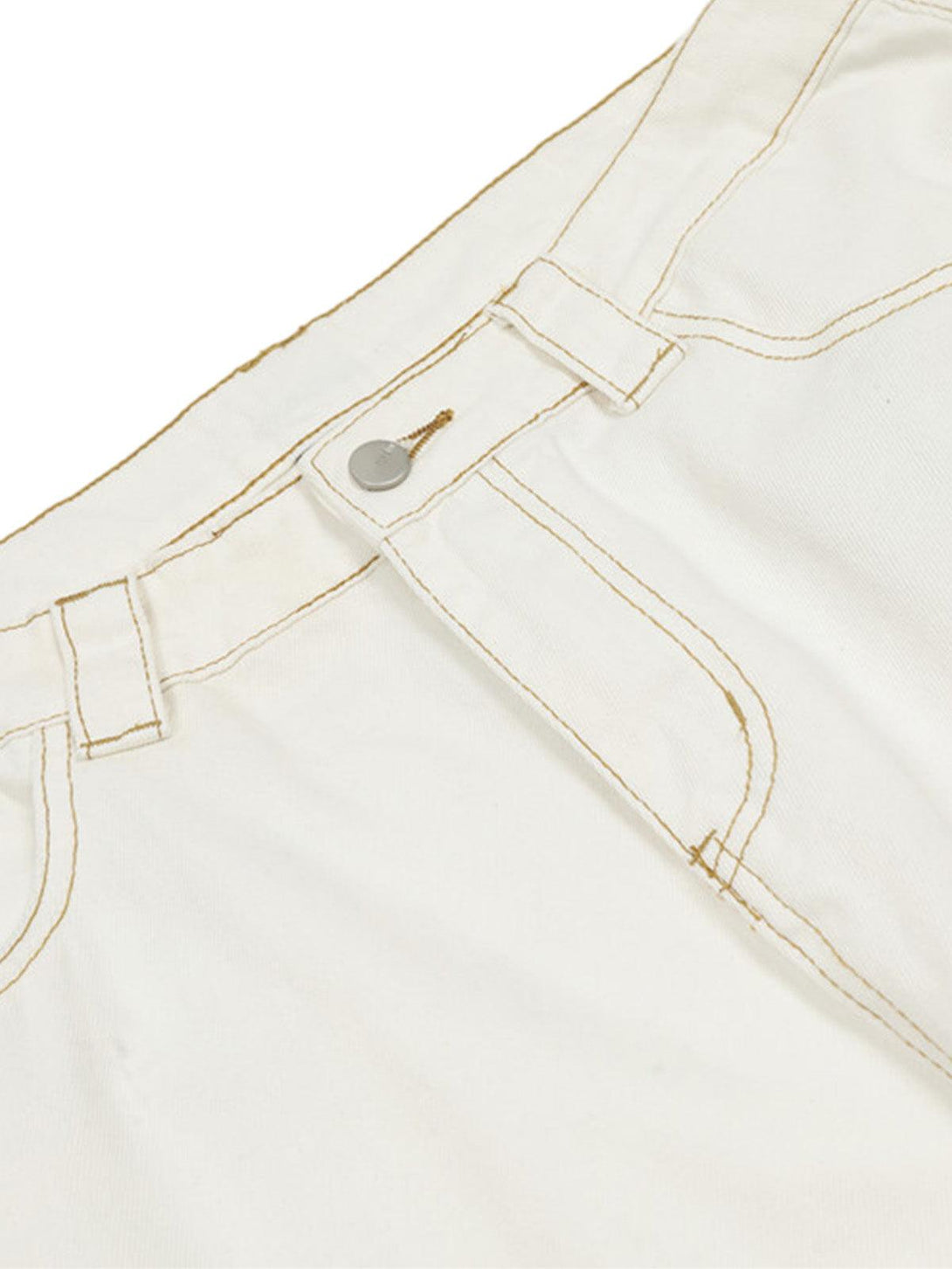 Detailed view of TALISHKO barrel jeans, showcasing white fabric and intricate stitching details.