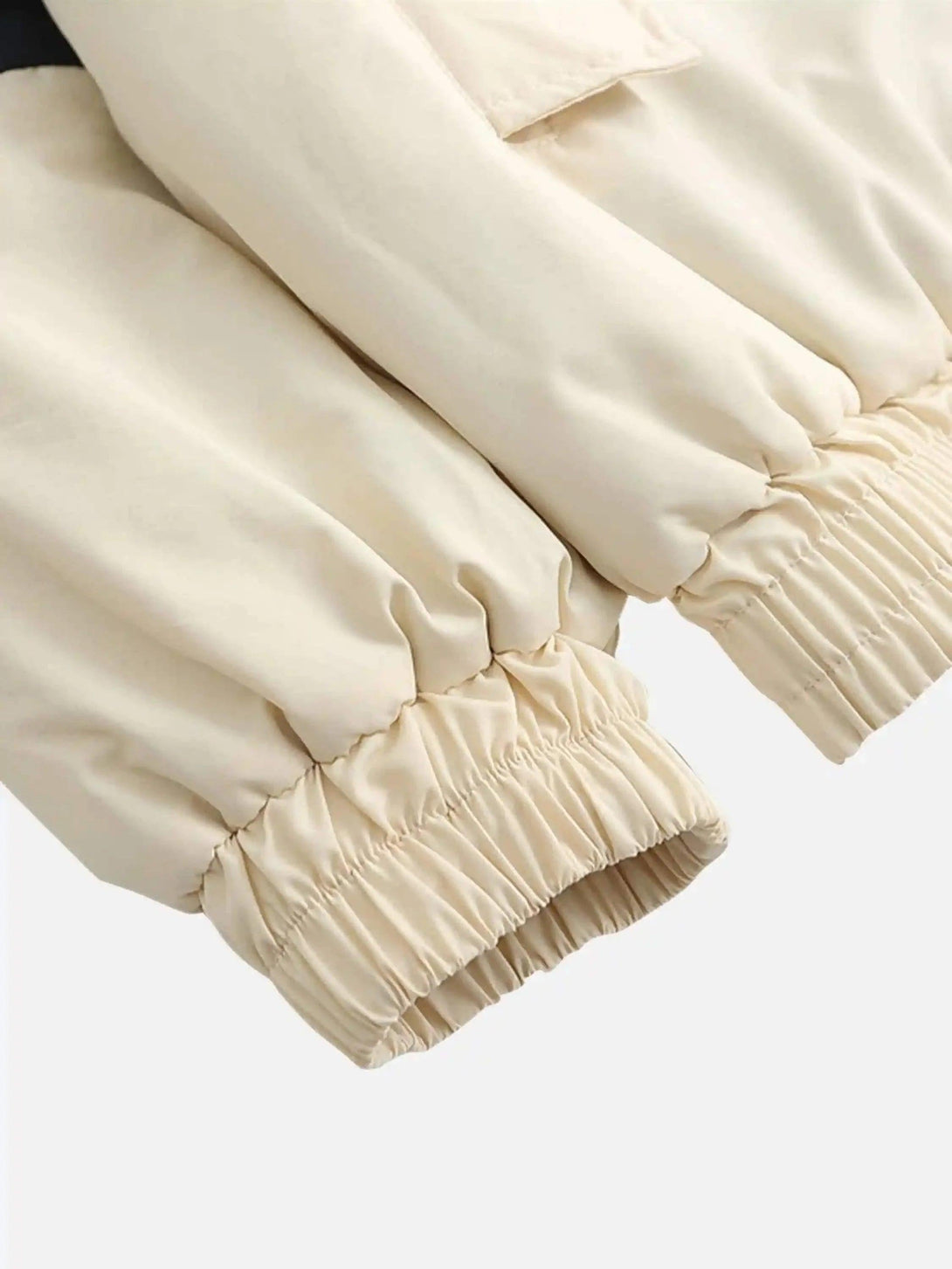 Elastic cuffs on TALISHKO's cotton jacket, highlighting detailed stitching and cozy style.