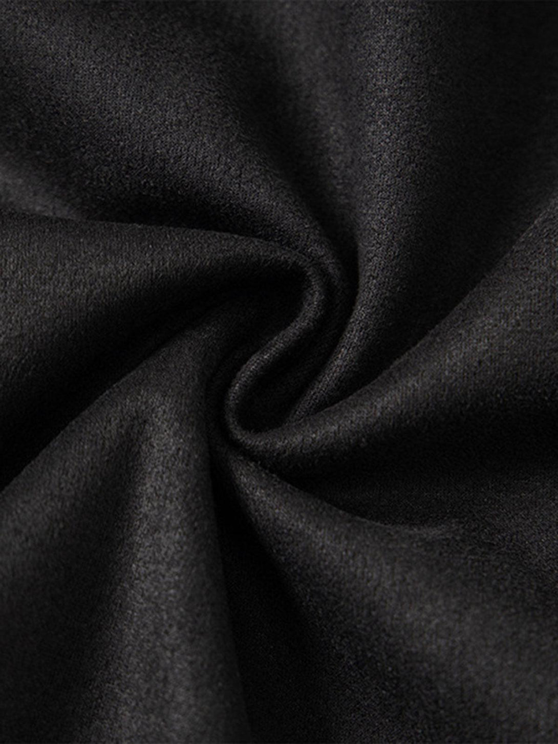 Zoomed-in texture of TALISHKO's black oversized T-shirt fabric, highlighting its smooth finish.