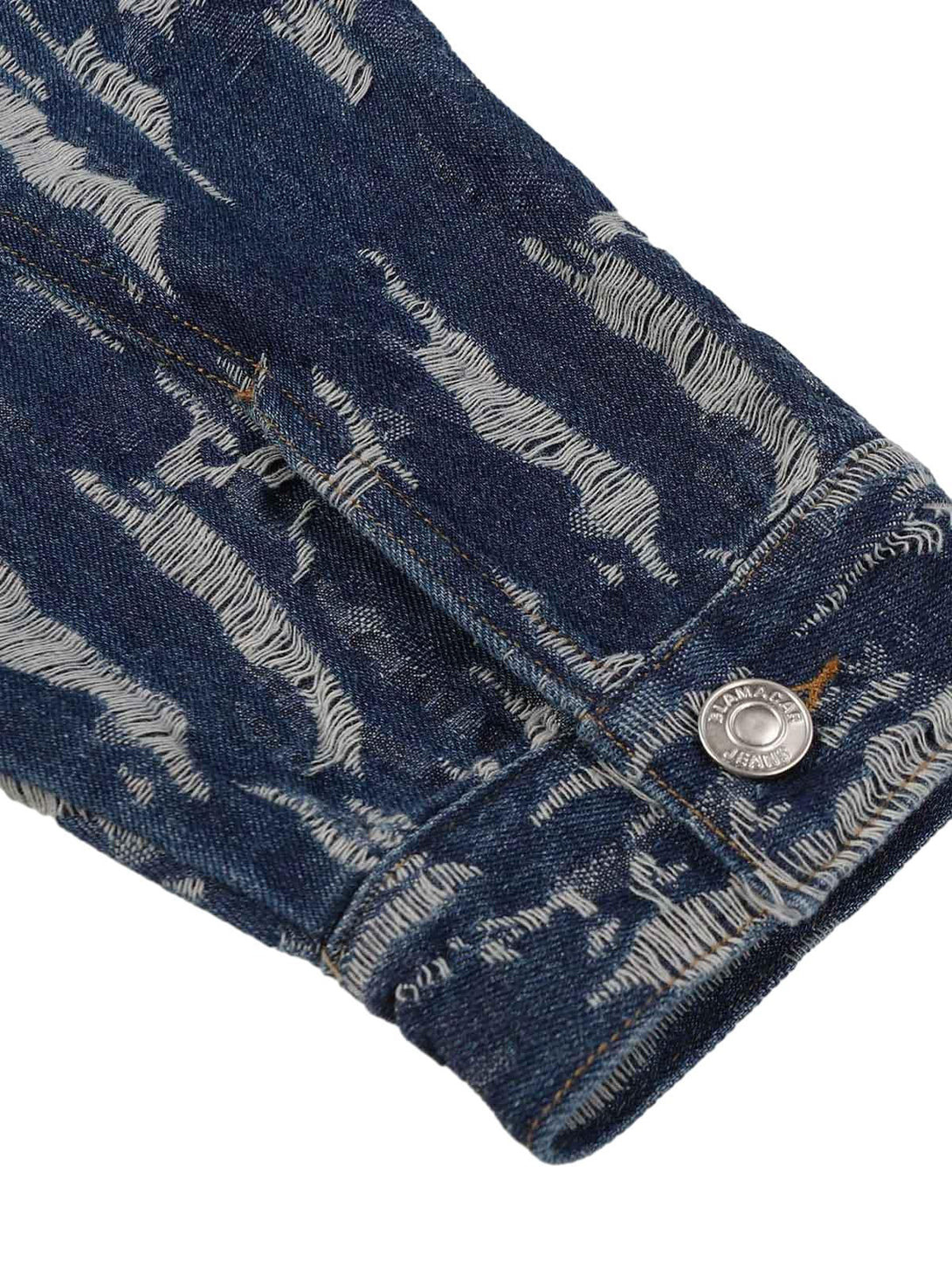 Detailed fabric and stitching on TALISHKO's embroidered denim hoodie sleeve, showcasing texture.