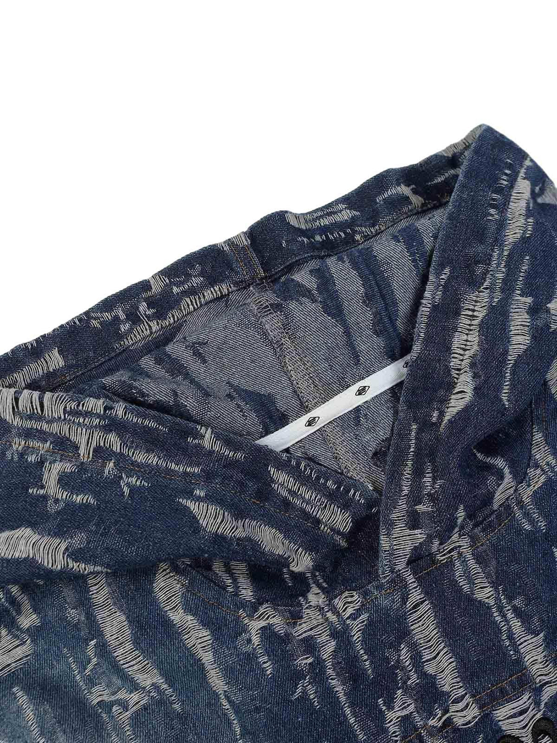 Intricate look at TALISHKO's embroidered washed denim hoodie, highlighting its unique texture.