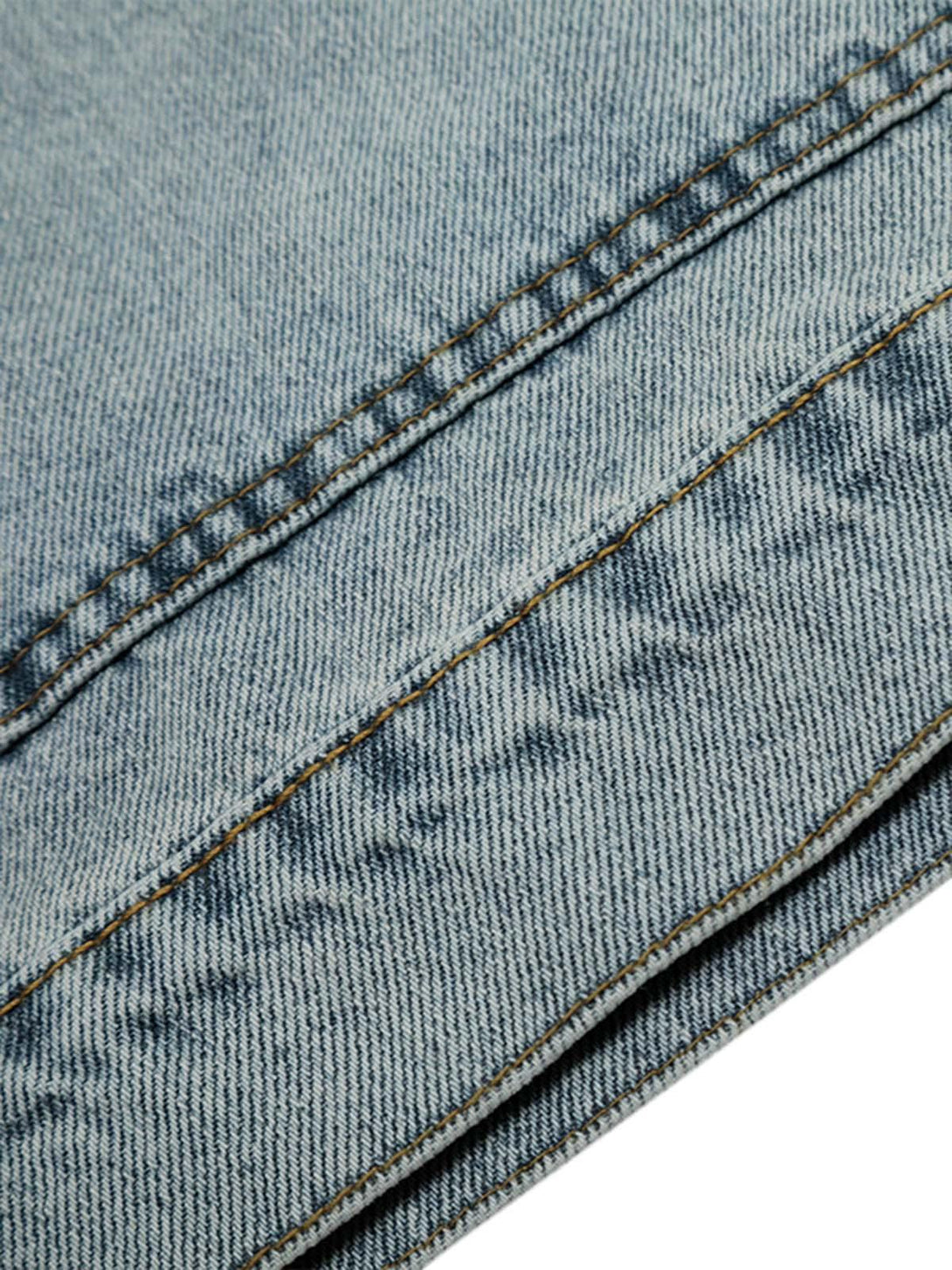 Detailed fabric and stitching of washed denim by TALISHKO, highlighting distressed texture.