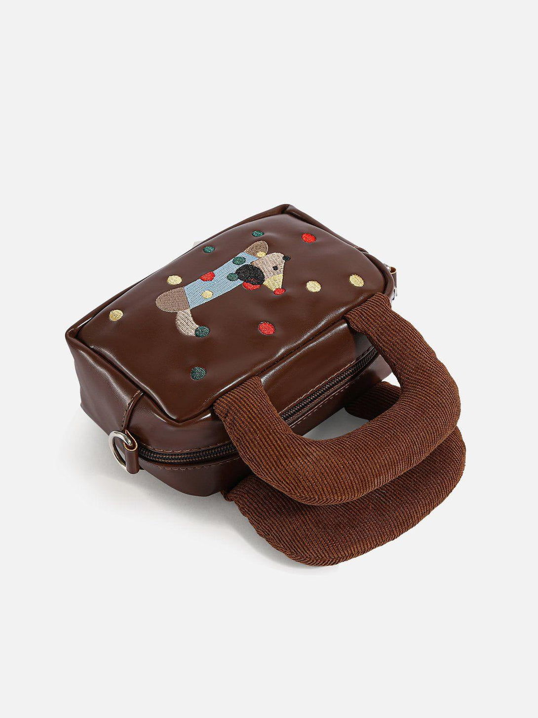 A playful TALISHKO bag with cartoon dog embroidery and plush handles, perfect for casual outings.