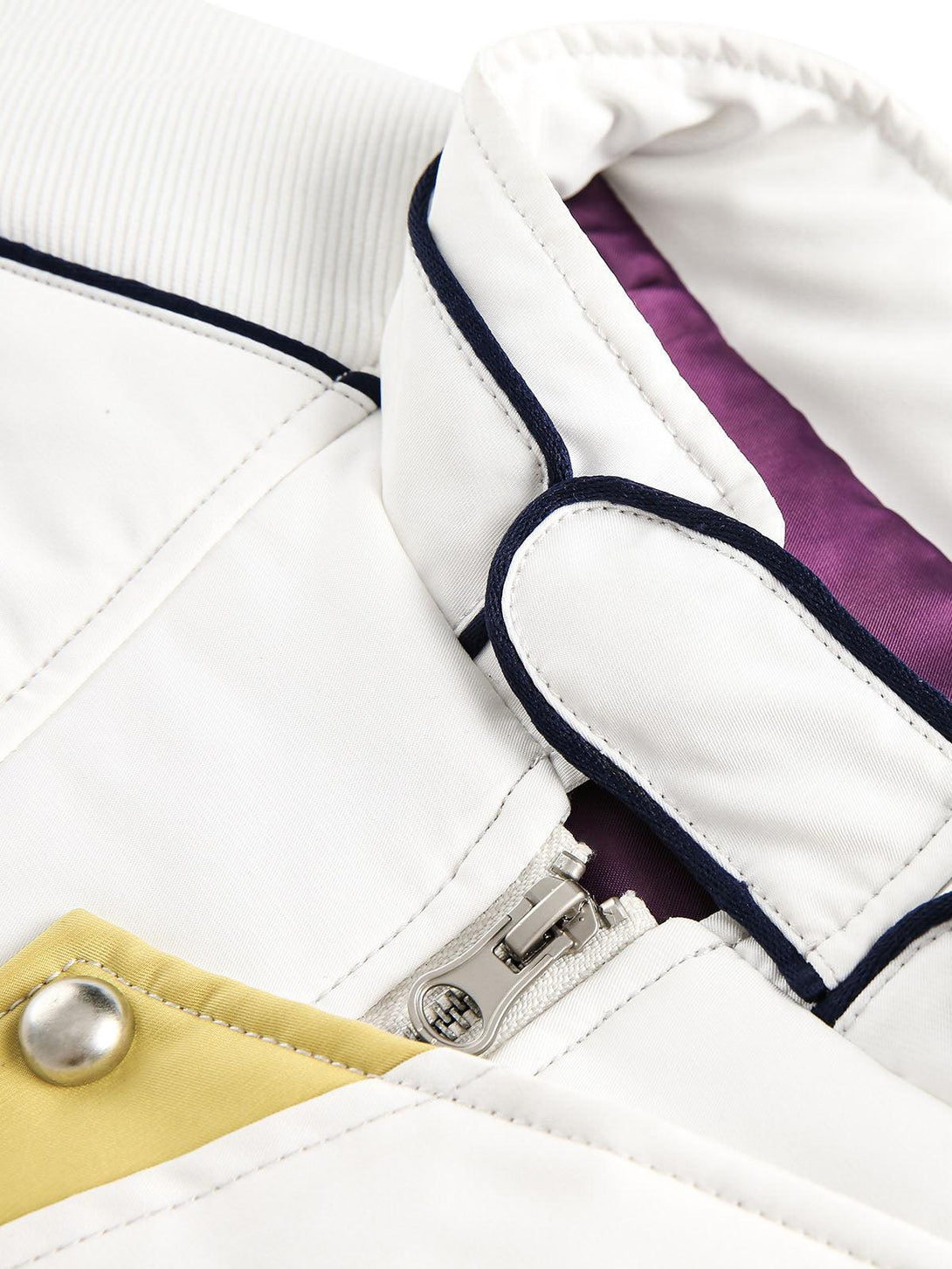 A detailed view of the TALISHKO bomber jacket's double-ended zipper and contrasting trims.