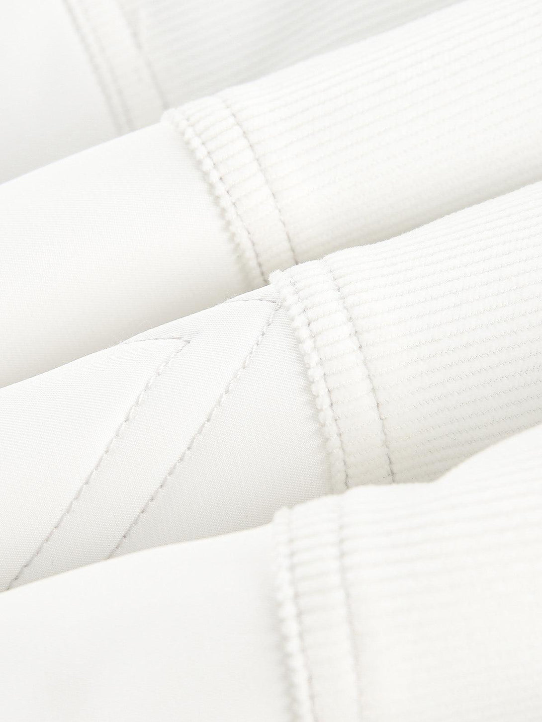 Detailed fabric and stitching on the TALISHKO bomber jacket, showcasing quality craftsmanship.