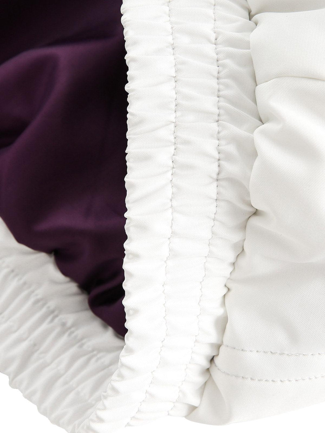 A close-up of the TALISHKO bomber jacket's elastic cuff, showcasing its precise stitching.