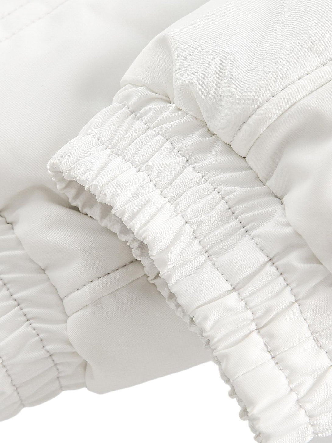 Elastic cuff detail on the TALISHKO bomber jacket, emphasizing its quality stitching.