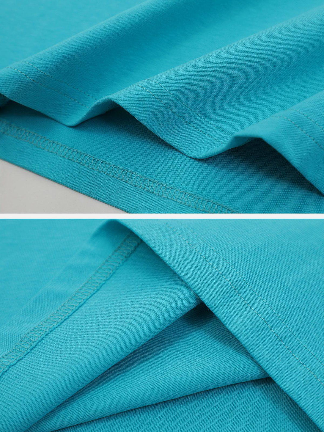 Detailed fabric and stitching of a blue TALISHKO tee, showcasing quality craftsmanship.