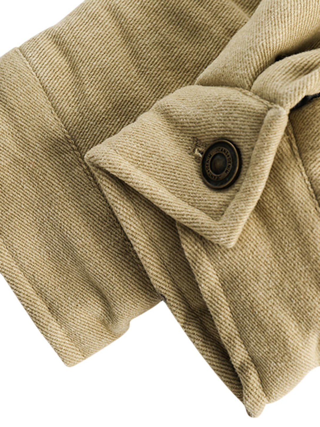 Detailed fabric and stitching on TALISHKO's barn jacket, showcasing texture and button detail.