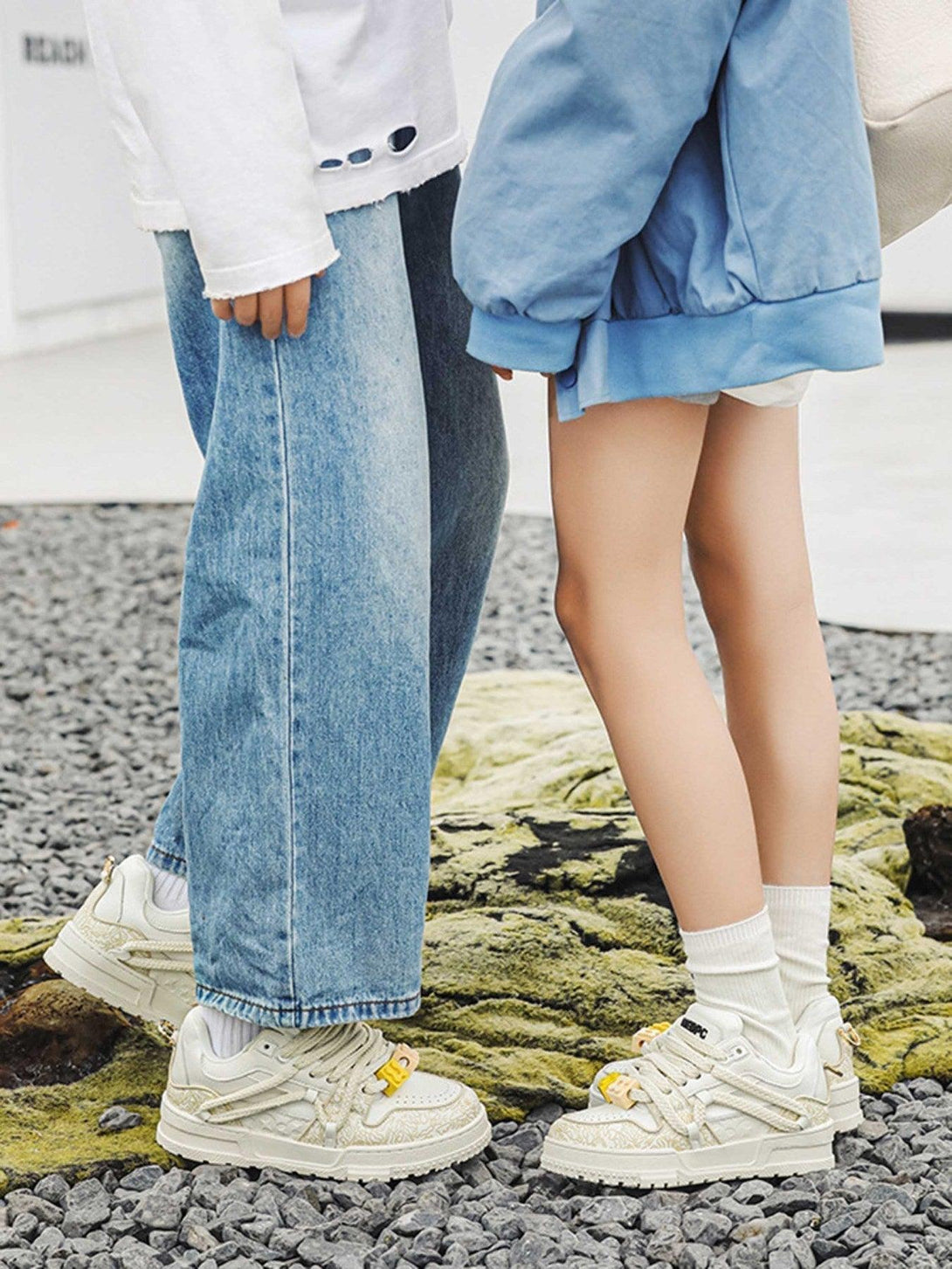 TALISHKO sneakers in cream, paired with casual outfits, highlighting unique lace details.