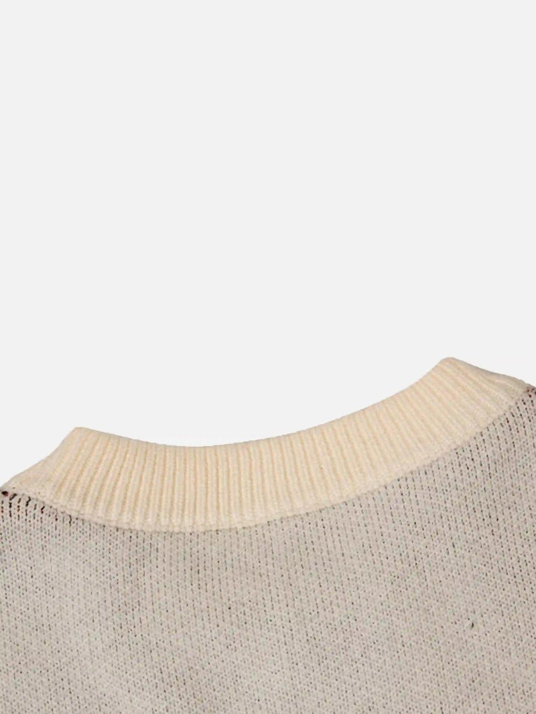 A detailed view of the ribbed neckline on the Eye Contact Sweater by TALISHKO.