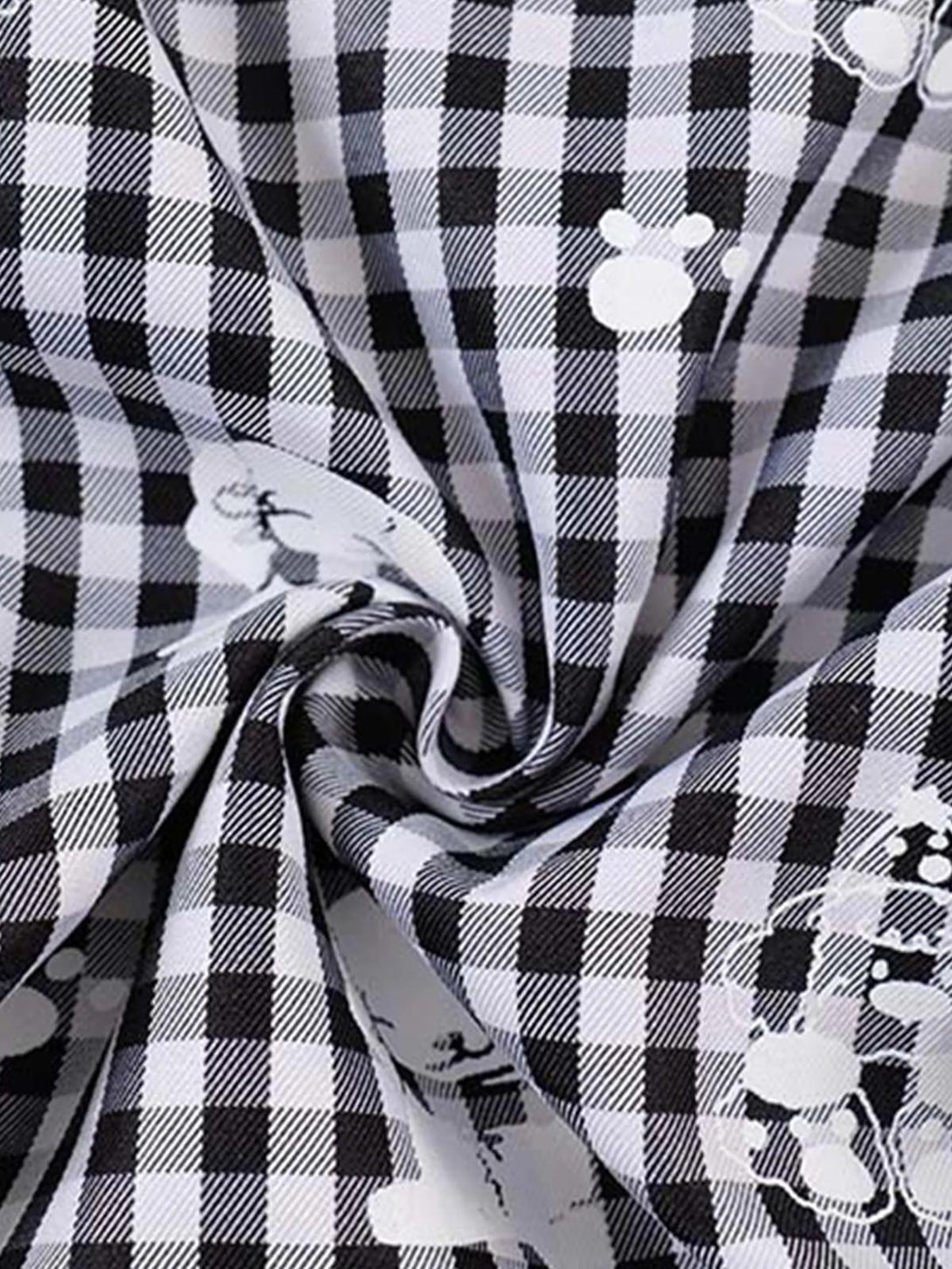 Intricate look at TALISHKO plaid fabric, highlighting playful print and texture detail.