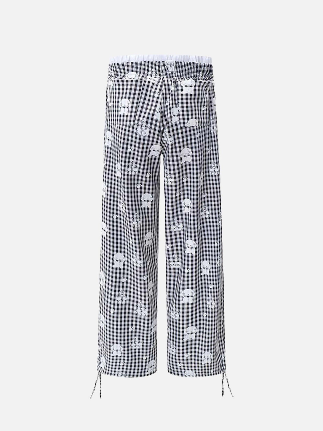 Back view of checkered plaid sweatpants with playful print by TALISHKO, featuring drawstring details.