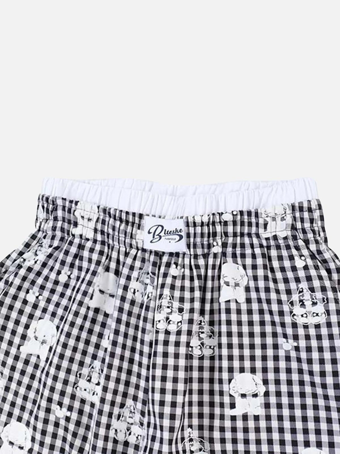 TALISHKO sweatpants showcasing checkered plaid pattern with playful print and elastic waistband.