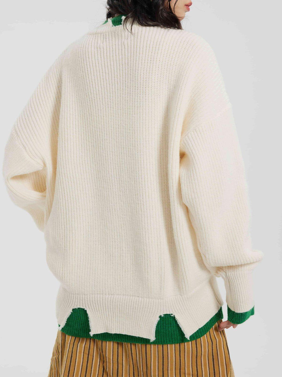 Back view of TALISHKO's fake two sweater, highlighting textured knit and green accents.