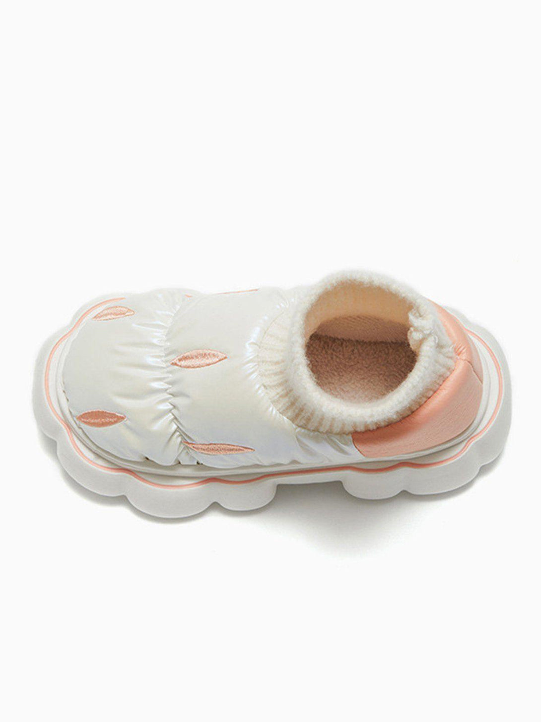 TALISHKO's cotton-padded shoe with quilted design and knit cuff, highlighting its cozy style.