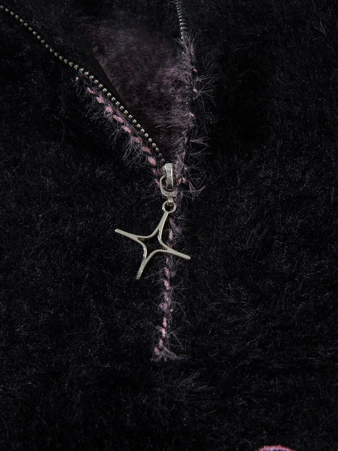 Intricate look at TALISHKO sweater's faux mink texture with unique zipper detail.