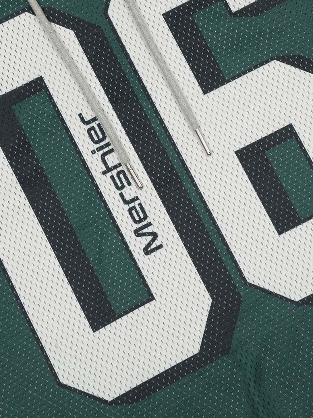 A detailed view of TALISHKO hoodie featuring bold number graphics and textured fabric design.