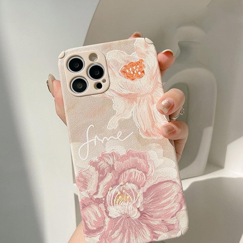 TALISHKO iPhone case with soft floral design, highlighting intricate pink and peach flowers.
