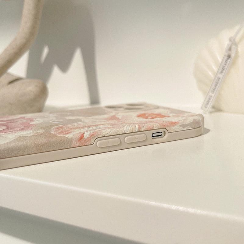 Side view of TALISHKO floral iPhone case, highlighting button details and elegant design.