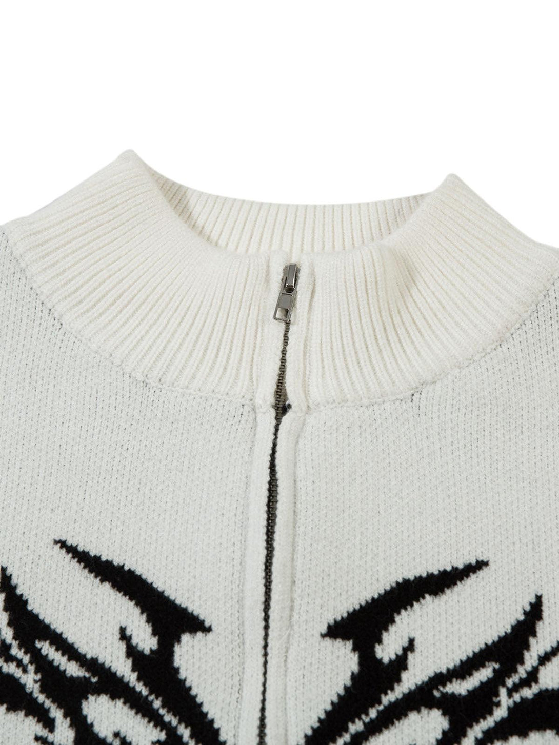 Intricate look at the zip and neckline of a TALISHKO flame-patterned mock neck sweater.
