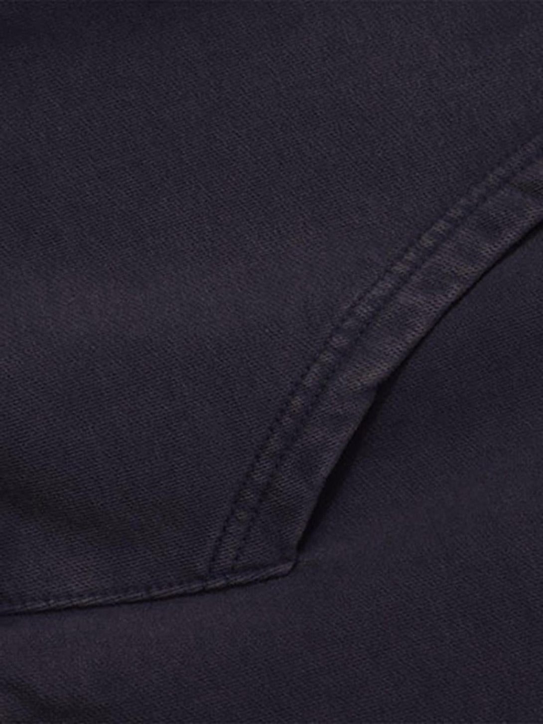 A detailed view of the TALISHKO flame letter washed hoodie fabric and stitching.