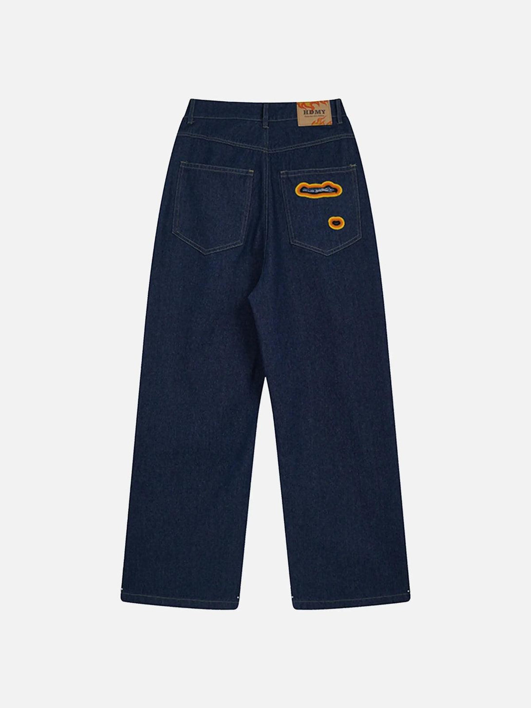 Back view of TALISHKO jeans with flame-scarred embroidery and unique pocket details.