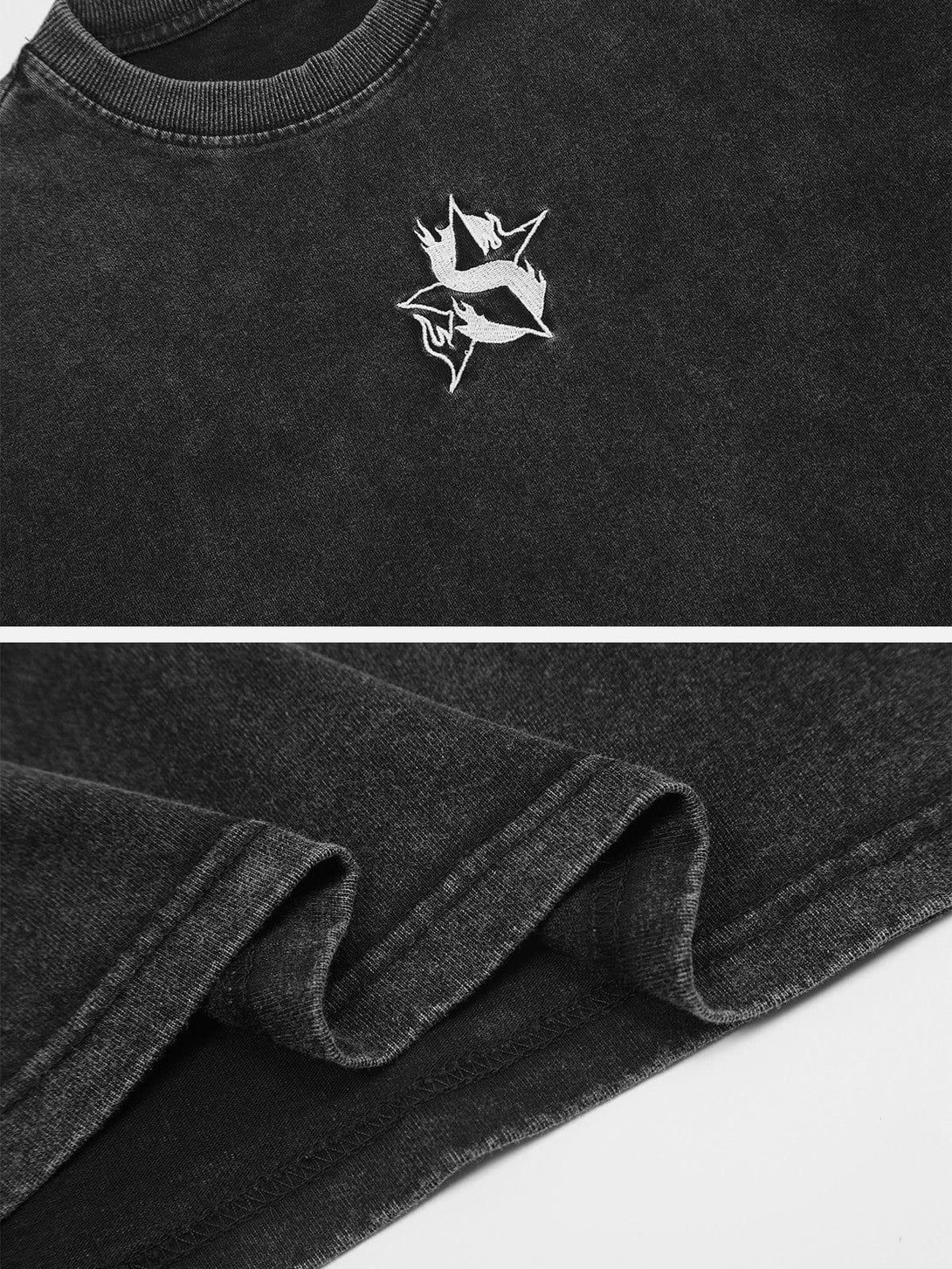 Detailed fabric and stitching of the black washed tee, featuring a flame star design by TALISHKO.