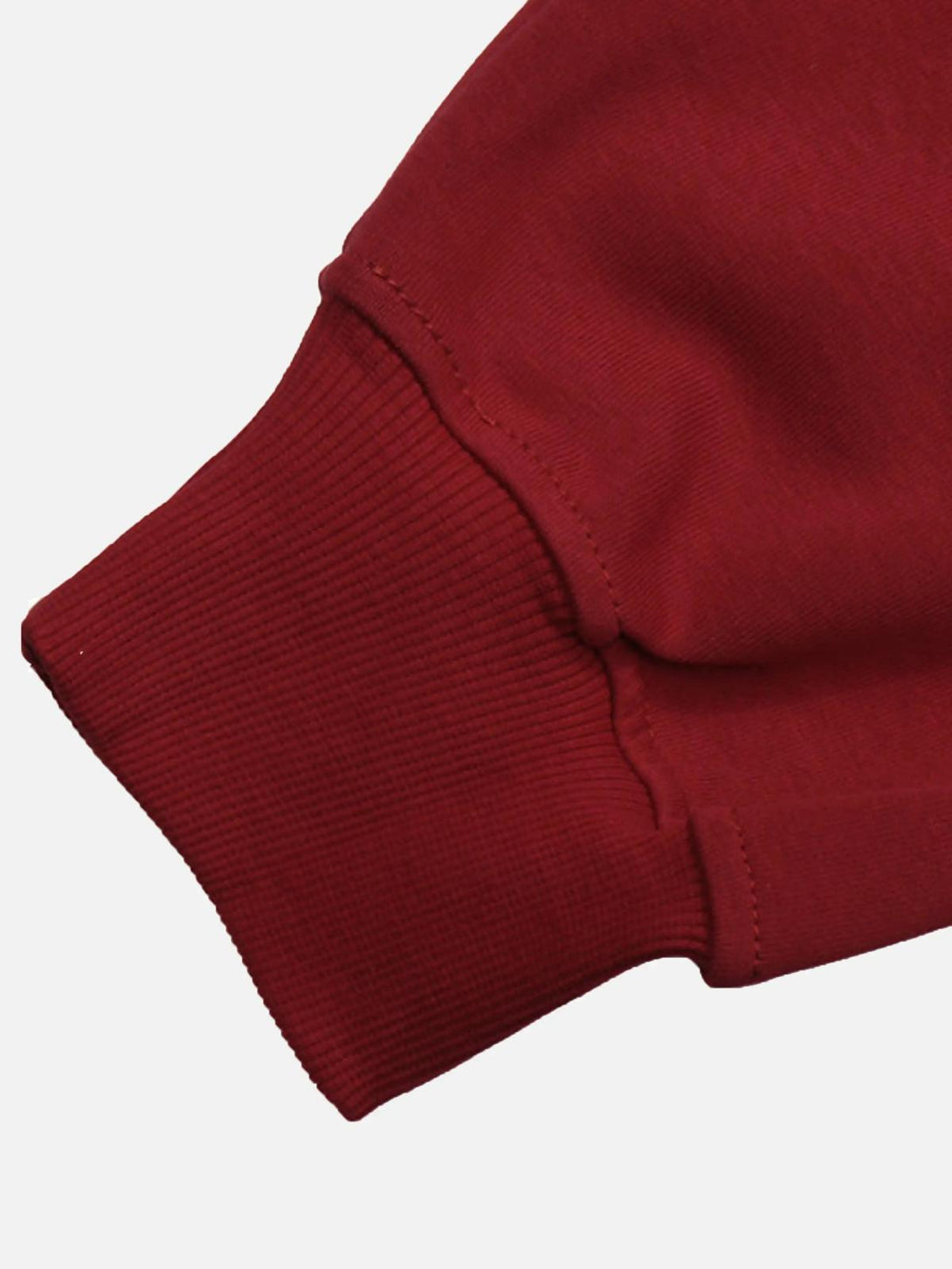 Detailed view of the TALISHKO hoodie cuff, highlighting the rich red fabric and ribbed texture.