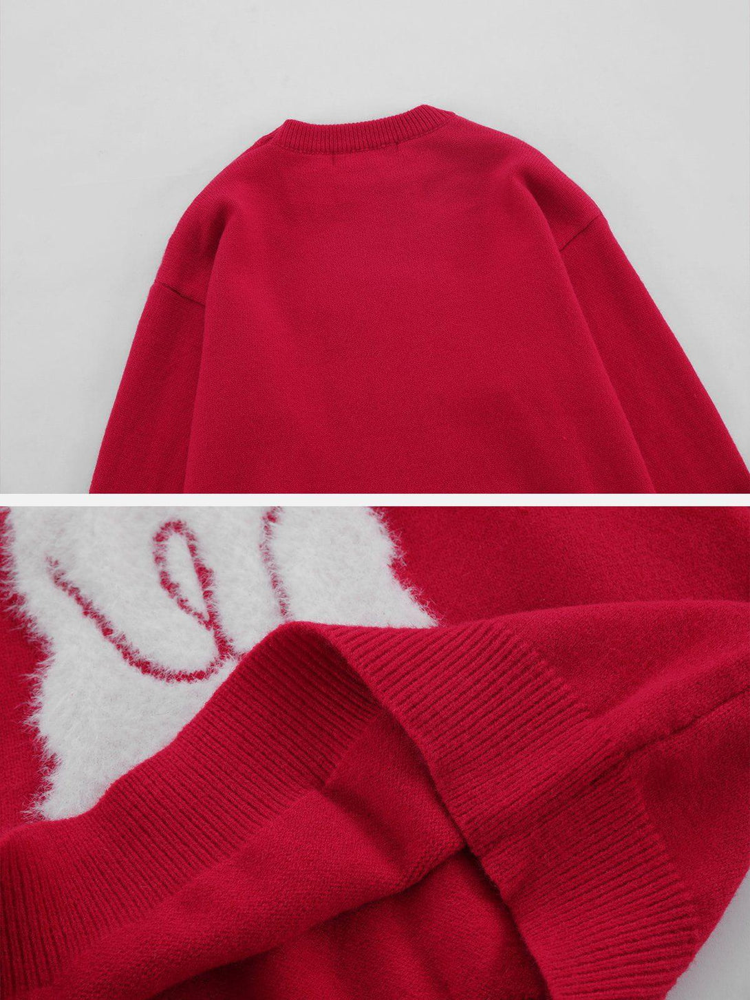 A tight crop highlighting TALISHKO's red sweater, emphasizing its textured knit and cozy design.