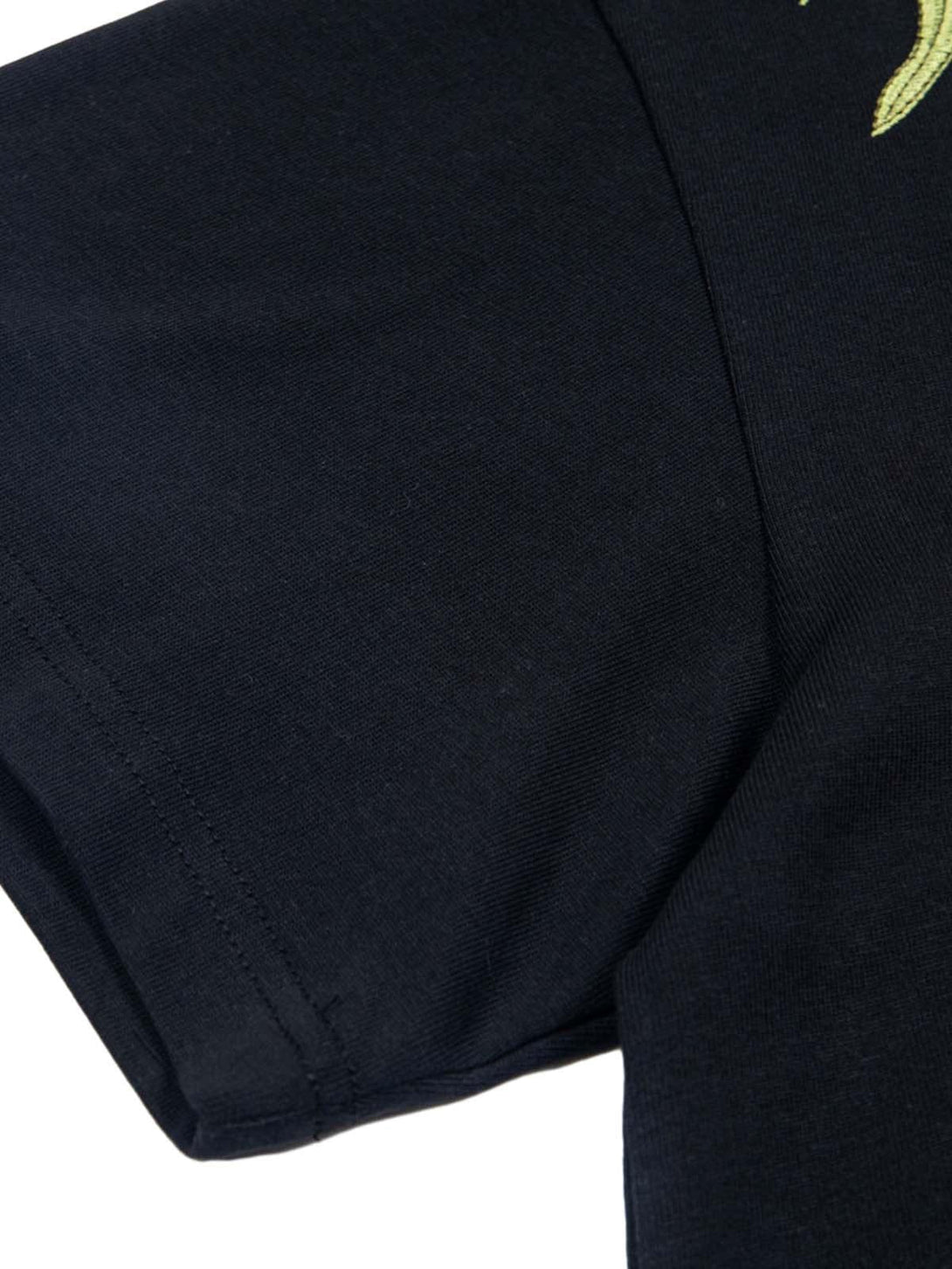 Detailed fabric and stitching on a black oversized t-shirt sleeve by TALISHKO.