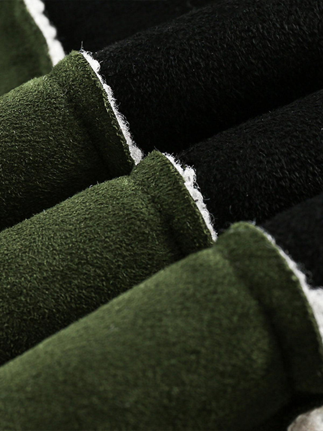 "Texture and pattern showcased in TALISHKO's green suede fleece jacket, highlighting its softness."