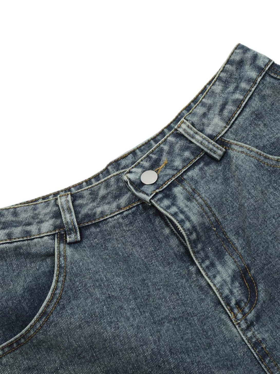 A close-up of TALISHKO denim shorts, highlighting the button and waistband details.