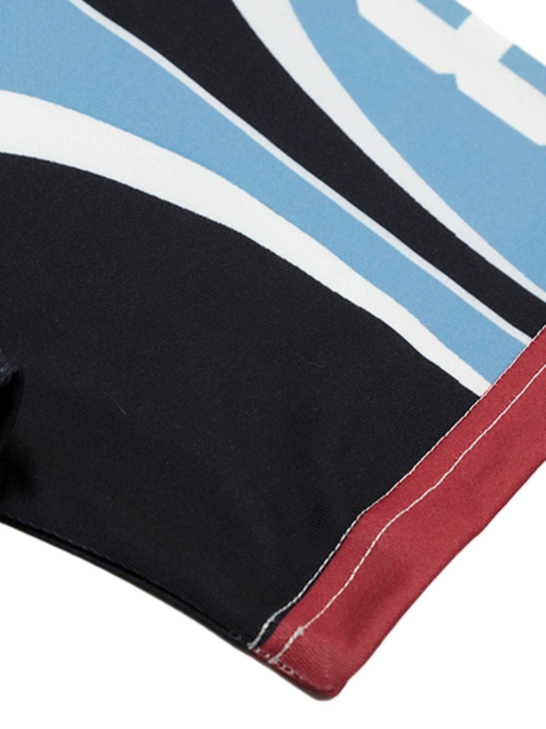 Intricate look at TALISHKO's floral jersey, highlighting bold color contrasts and detailed stitching.