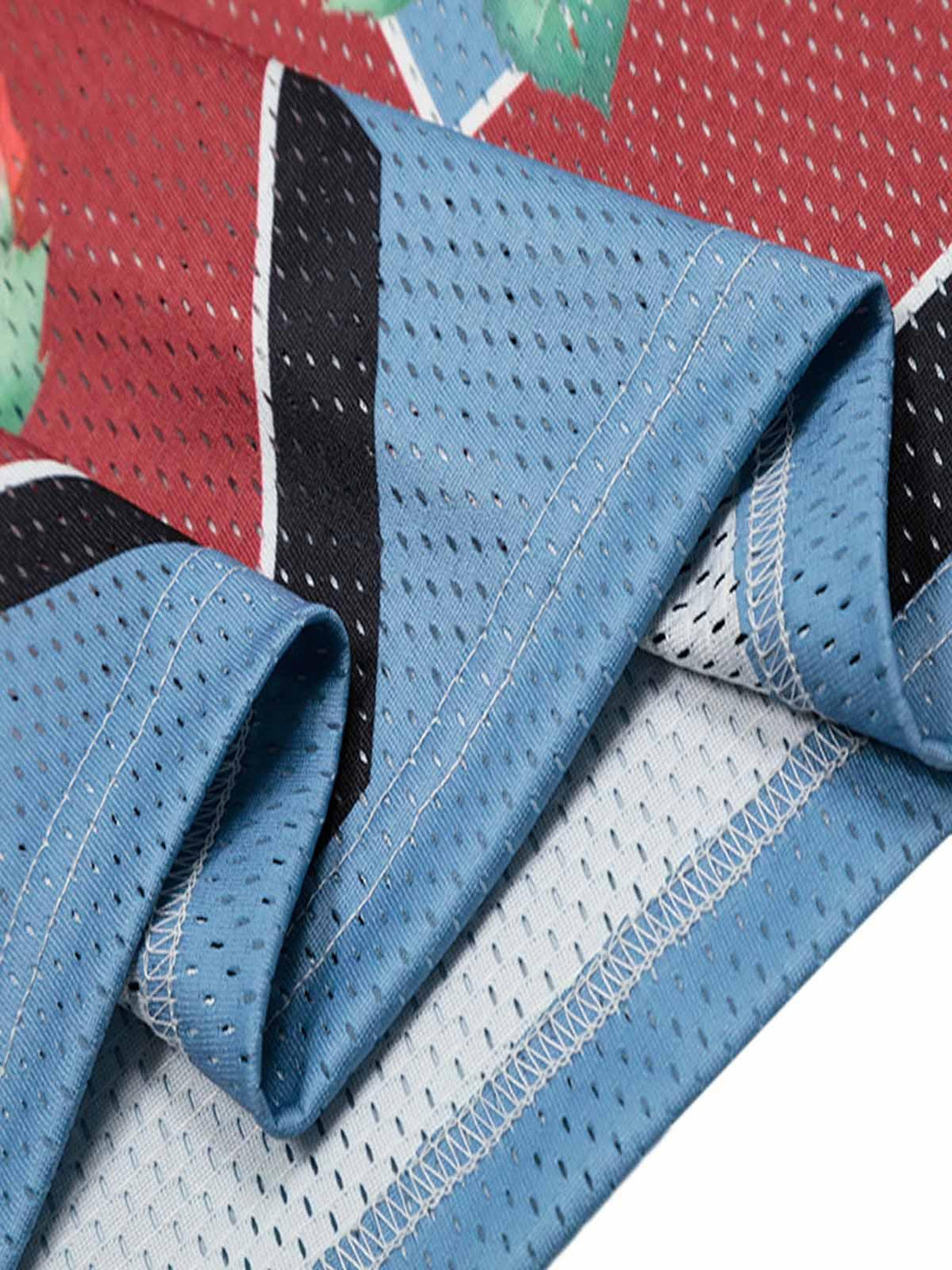 Detailed fabric and stitching of TALISHKO's floral print jersey, highlighting vibrant textures.