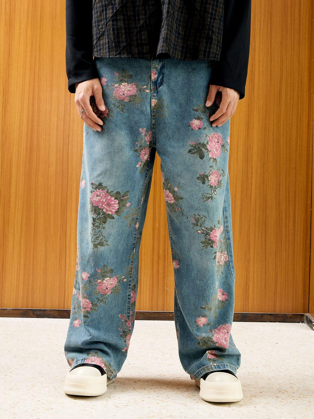Model wearing floral print straight jeans by TALISHKO, paired with casual shoes for a relaxed look.