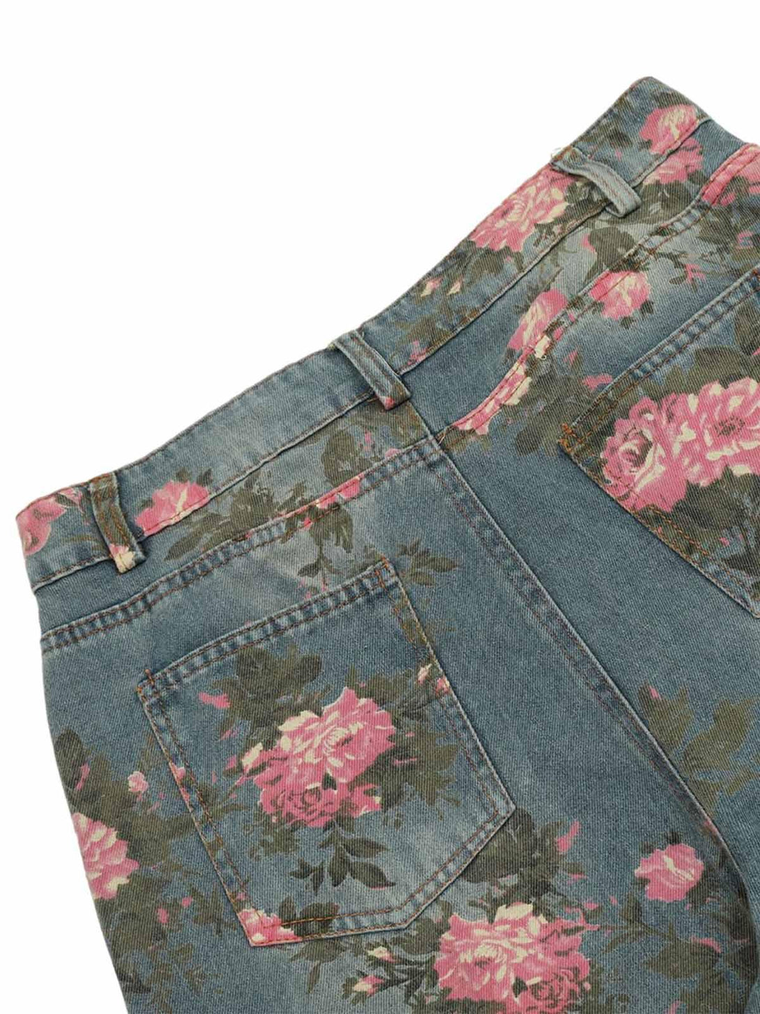 Detailed fabric and stitching of TALISHKO floral print jeans, highlighting pink rose patterns.