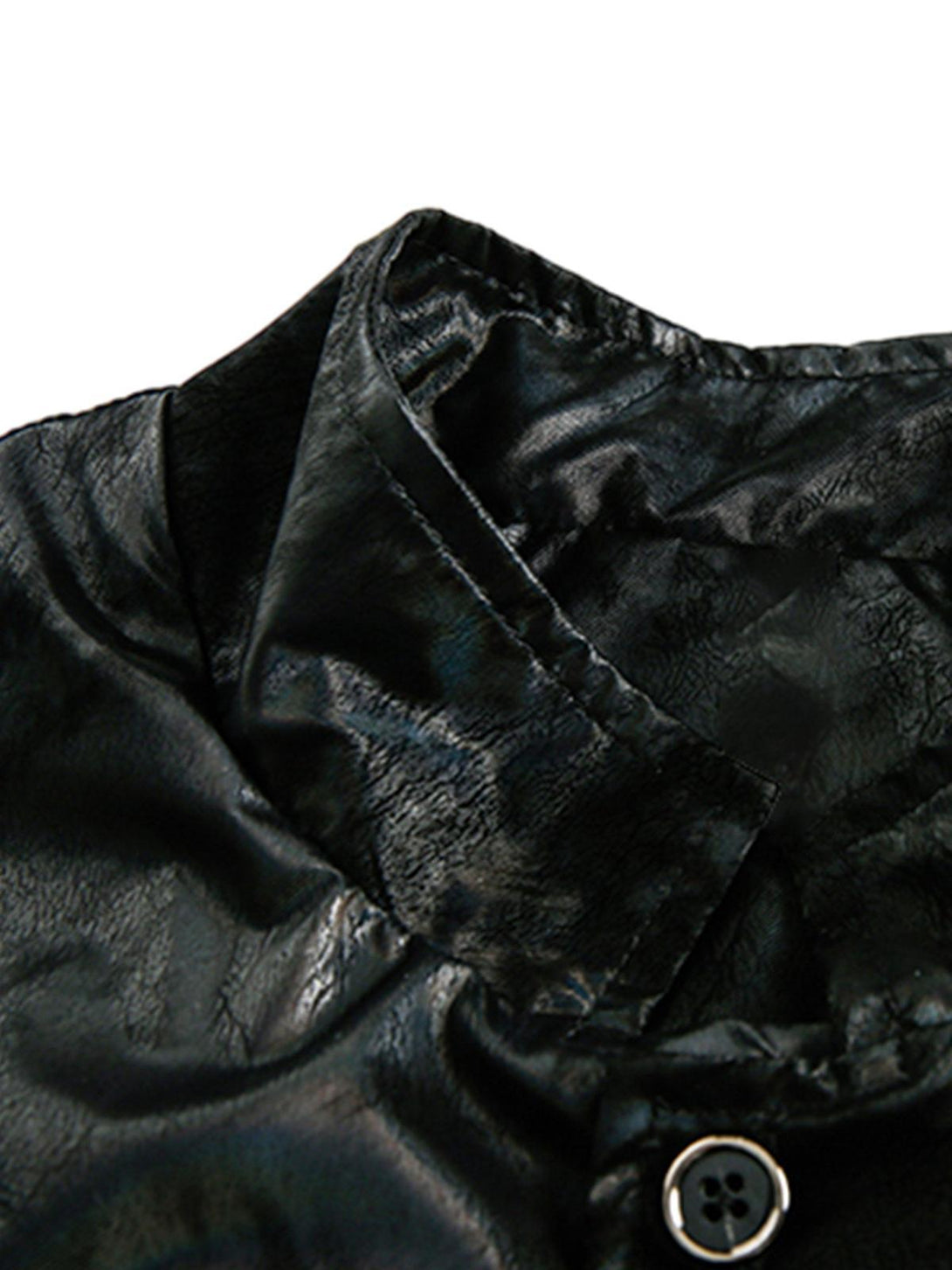 A detailed view of the stand collar and button detail on a leather jacket by TALISHKO.