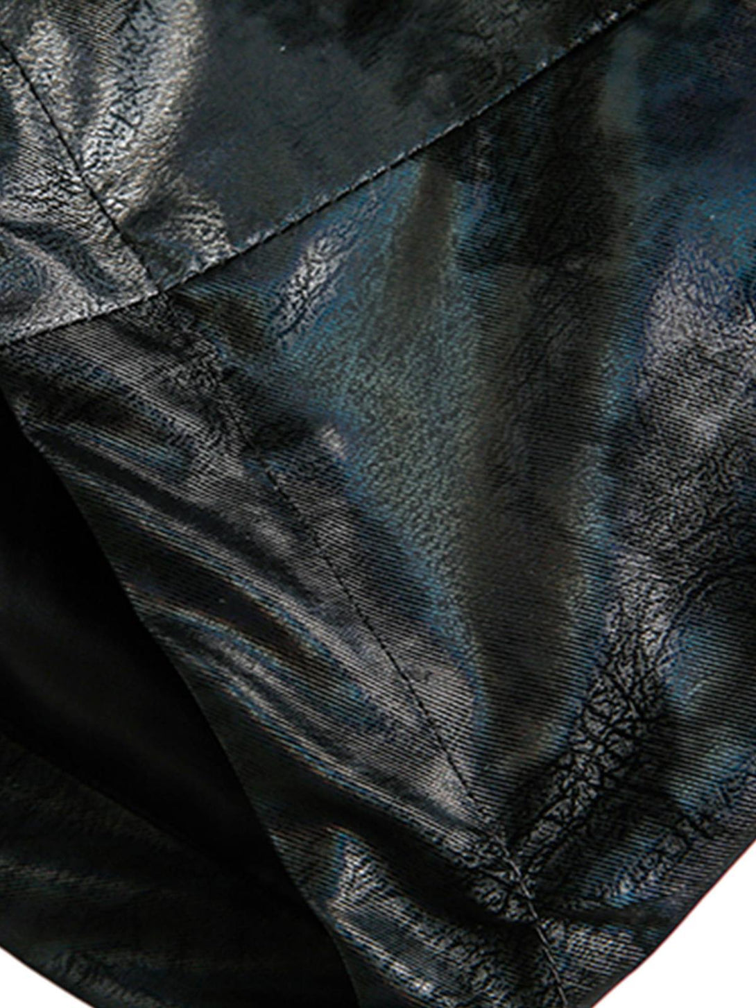 Zoomed-in texture of TALISHKO leather jacket, highlighting its glossy finish and fine stitching.