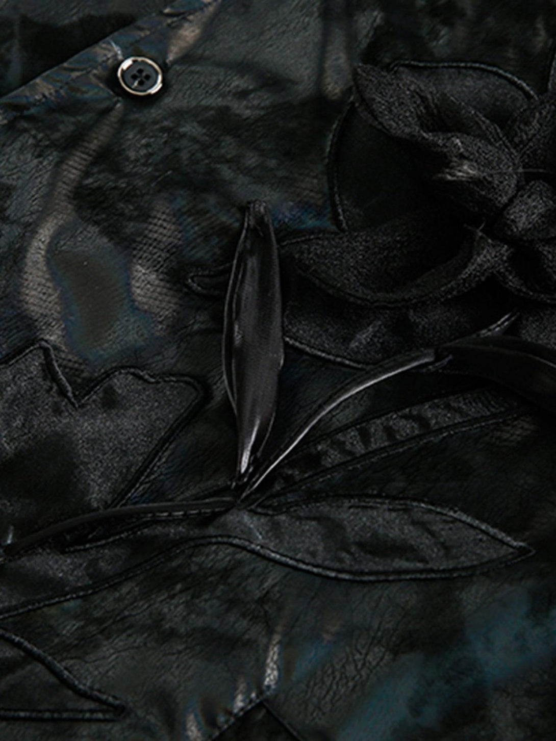 Intricate look at floral detailing on TALISHKO leather jacket, showcasing elegant craftsmanship.