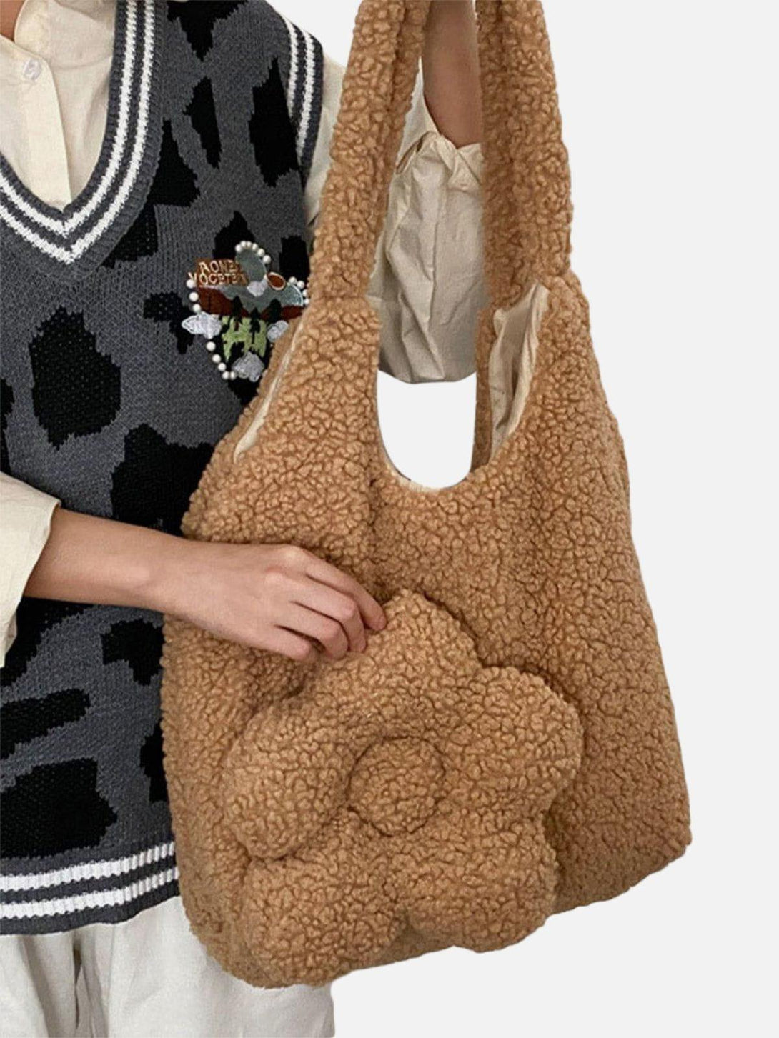 TALISHKO Flower Sherpa Bag with a plush floral design, adding a cozy touch to any look.