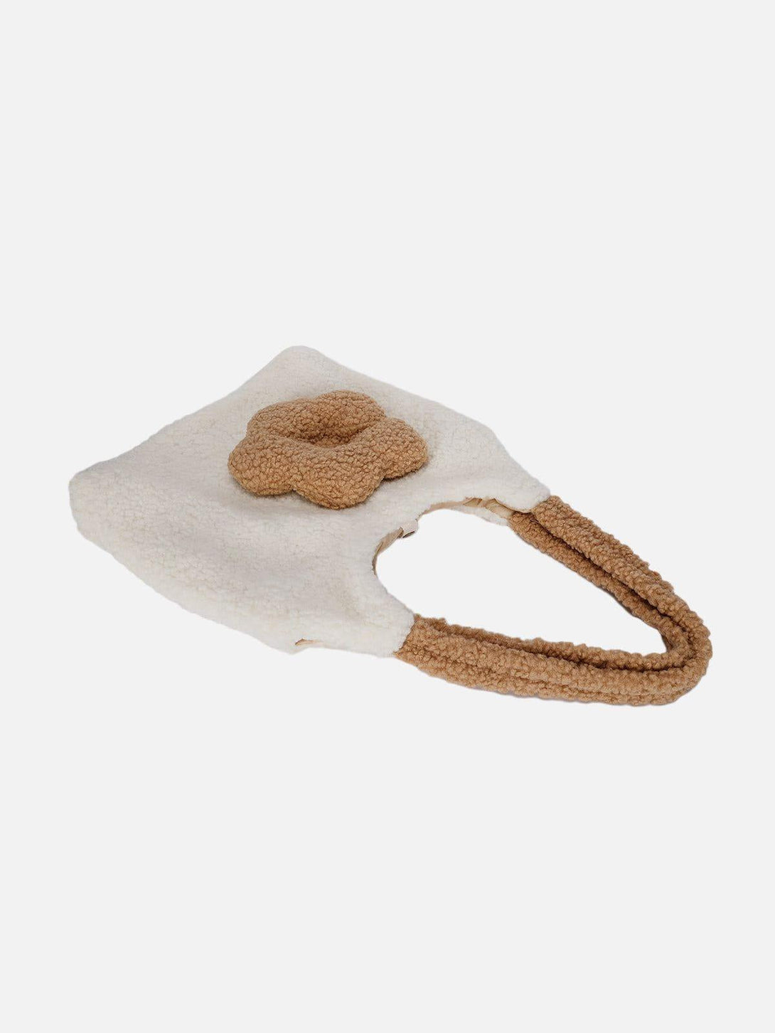 TALISHKO's Flower Sherpa Bag features a plush design with cozy brown handles.