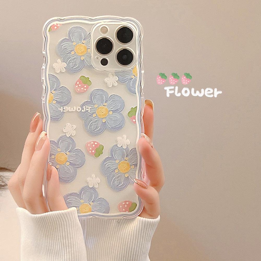 TALISHKO iPhone case highlights blue flowers and strawberries with a unique wavy edge design.