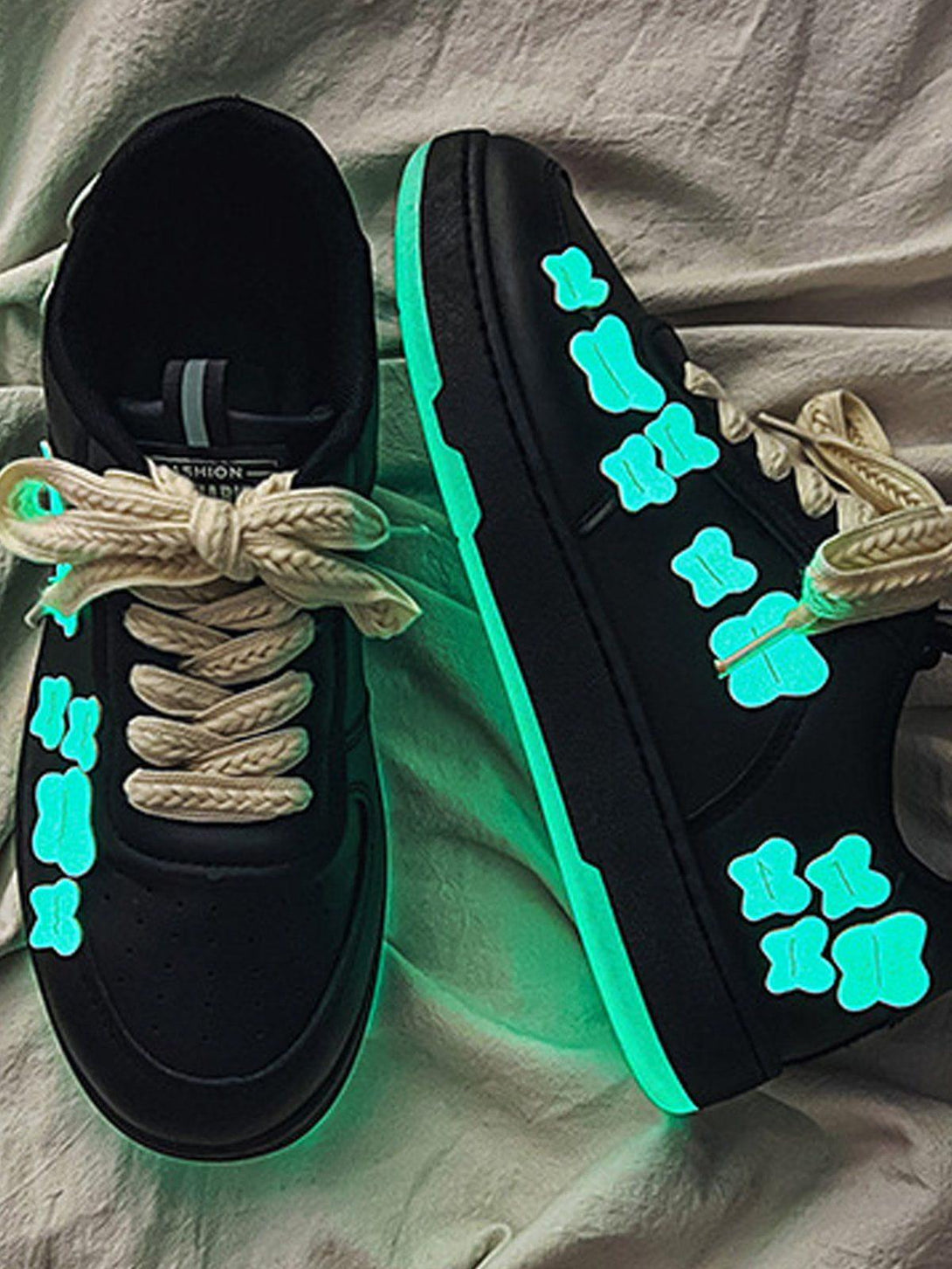 TALISHKO skate shoes with glowing butterfly designs, showcasing vibrant street style flair.