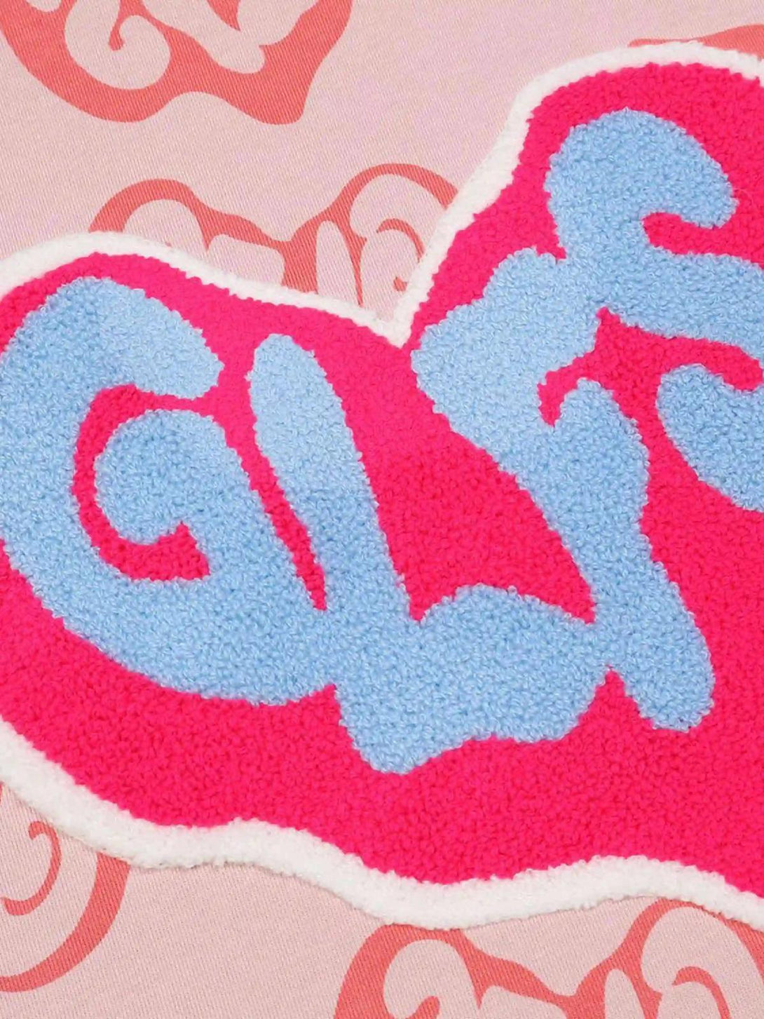 A detailed view of the colorful graphic design on a Foam Heart Hoodie by TALISHKO.