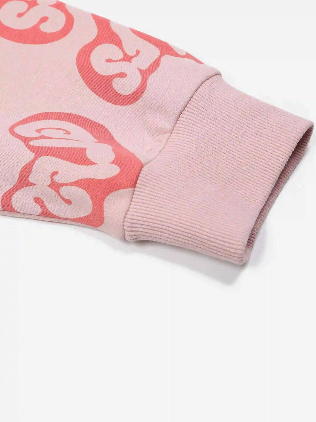 A tight crop highlighting the sleeve design of a pink Foam Heart Hoodie by TALISHKO.