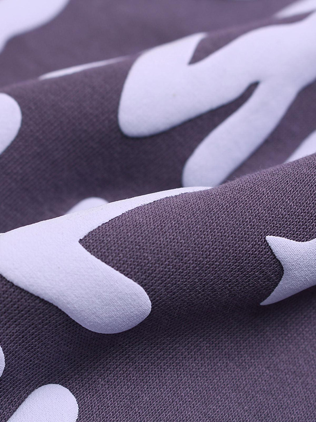Texture and pattern showcased on a TALISHKO hoodie, highlighting the foam letter design.