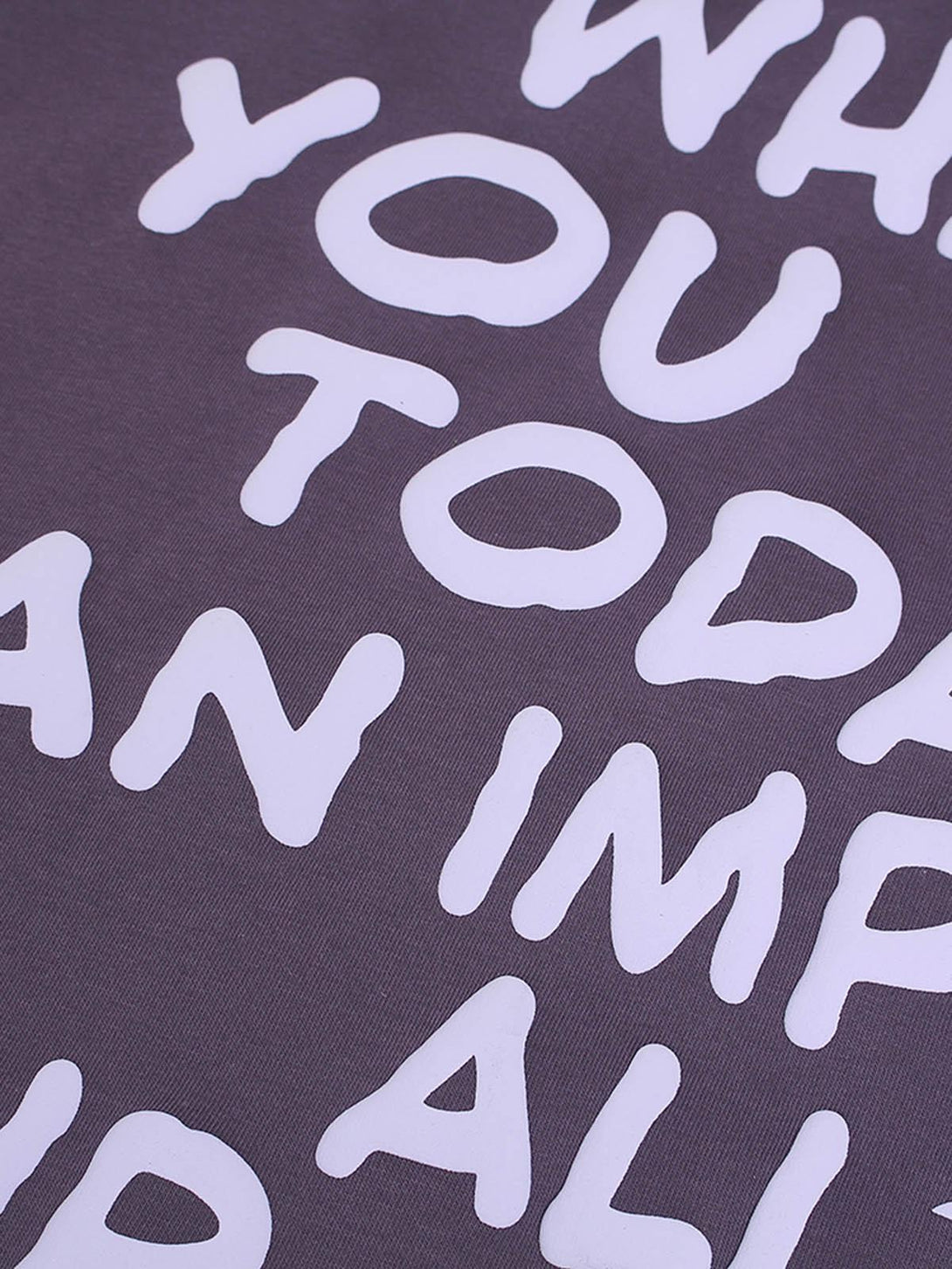 Focusing on the foam letter design on a TALISHKO hoodie, showcasing bold white text detail.