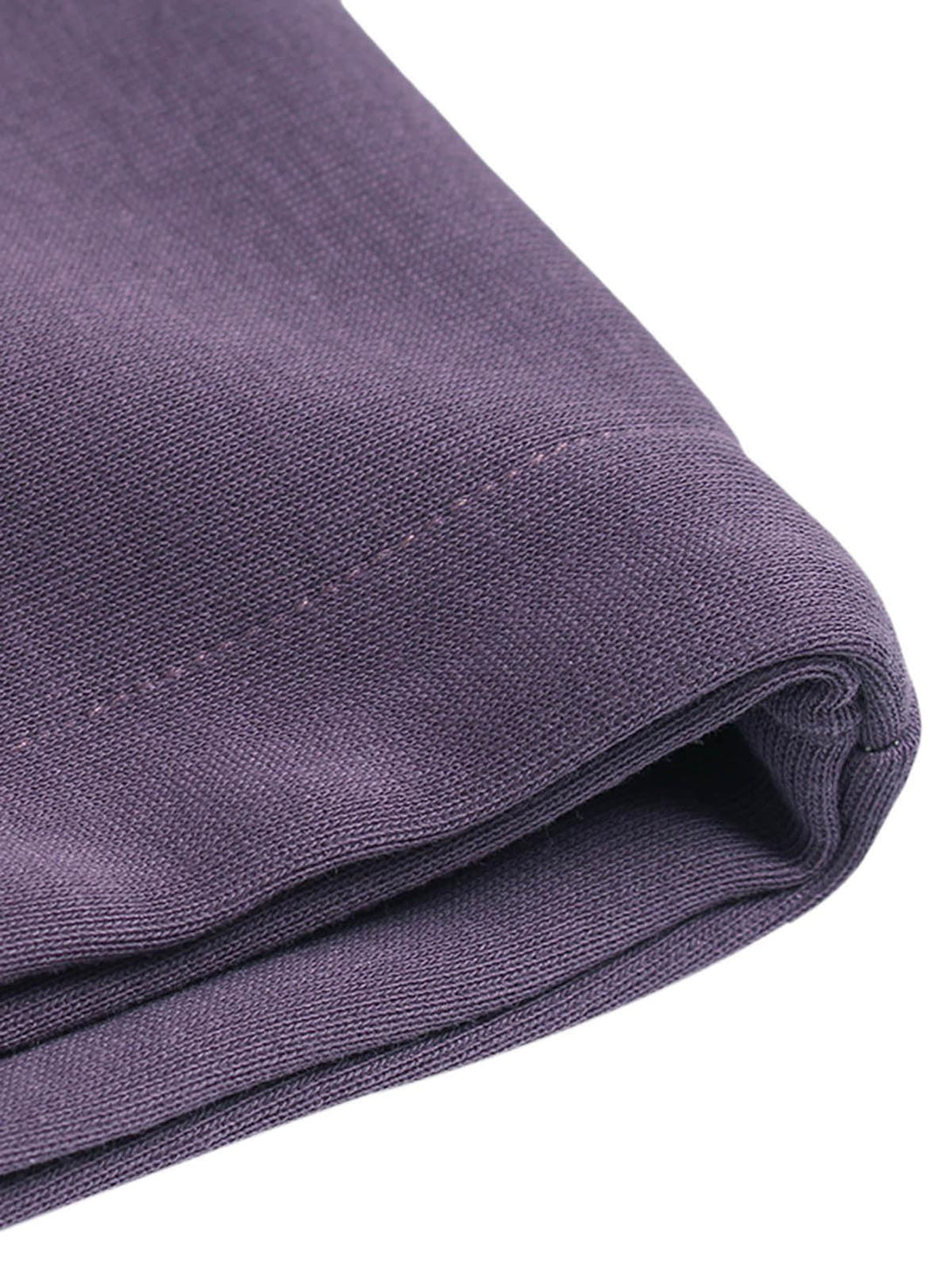 Intricate look at the purple fabric texture of a TALISHKO hoodie, showcasing craftsmanship.